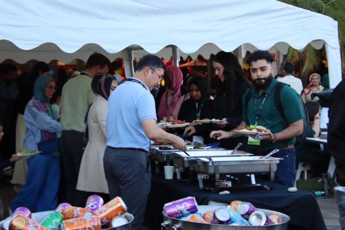Conference attendees at a shared meal