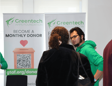 Image of two people at a exhibition stall